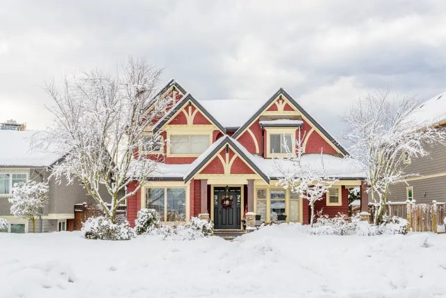 A typical American house in winter. Snow covered.